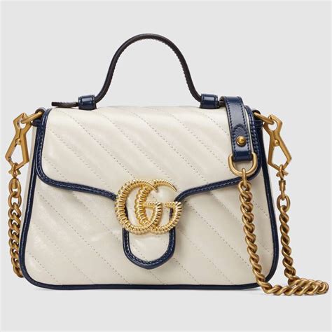 white Gucci shopping bag